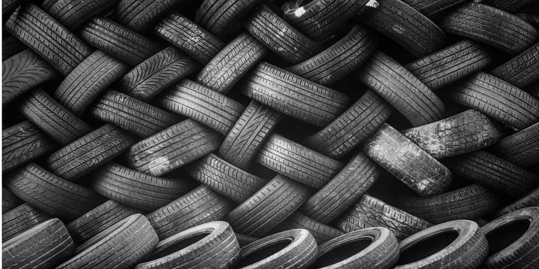 Rubber ballistic interlocking blocks made from recycled tires